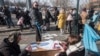 Ուկրաինացի փախստականները դիմումներ են լրացնում Չեխիայի ոստիկանության օտարերկրացիների վարչությունում, Պրահա, 2 մարտի, 2022թ.