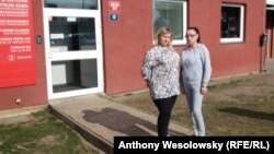 Oksana Malyuta (left), a refugee from Ukraine, with a helper from the dormitory where she is staying that is connected to the Slavia soccer club in Prague.