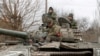 Ukraine - Pro-Russian pro-Russian troops are seen atop of a tank in the separatist-controlled settlement of Buhas (Bugas), in the Donetsk region, Ukraine March 1, 2022. 