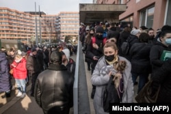 Ukrainian refugees apply for residence permits at Prague's foreigner's police headquarters on March 2