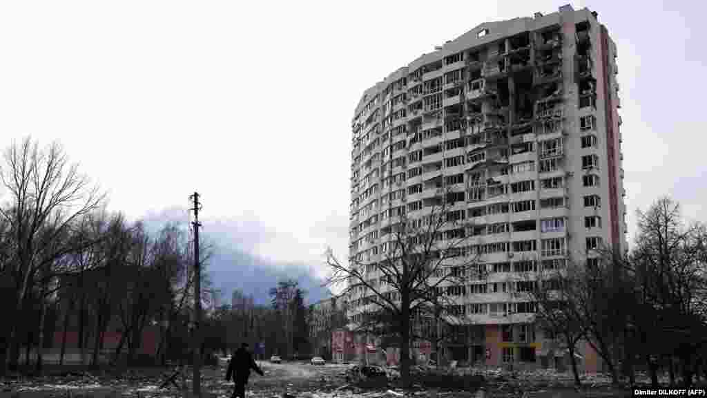 UKRAINE - A man walks in front of a residential building damaged in yesterday's shelling in the city of Chernihiv on March 4, 2022