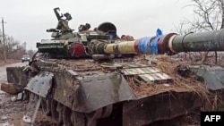 An image released by the Russian Defense Ministry on March 4 shows a destroyed Ukrainian Army tank in the settlement outside Mariupol.