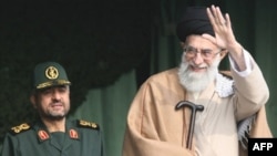 Is Supreme Leader Ayatollah Ali Khamenei (right) simply a pawn of the Revolutionary Guard, and its commander, General Mohammad Ali Jafari?