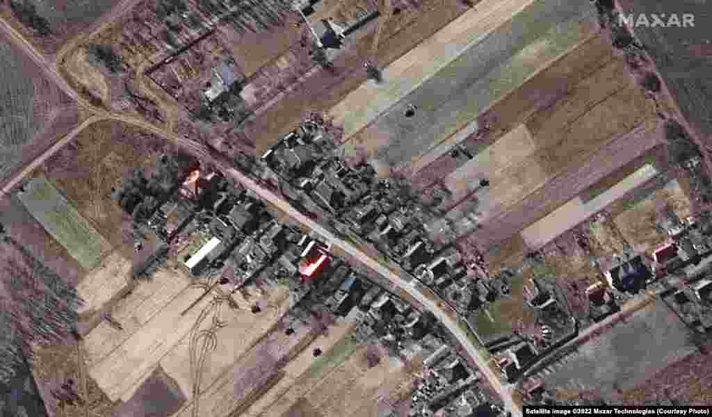A military deployment of Russian armored vehicles in a residential area in Ozera, northwest of Kyiv.
