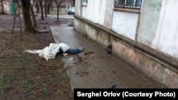 The body of a dead civilian in Mariupol in March.