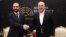 Turkish Foreign Minister Mavlut Cavusoglu (right) shakes hands with Armenian Foreign Minister Ararat Mirzoian in Antalya on March 12.