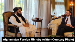 Amirkhan Mottaqi, the acting foreign minister of the Taliban-led government, meets with U.S. Special Representative for Afghanistan Thomas West. (file photo)
