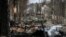 Destroyed Russian armored vehicles litter the battlefield in the city of Bucha, west of Kyiv, in early March.