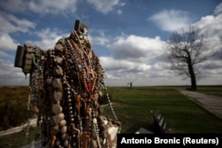 Rosaries are displayed at the Ovcara mass grave site near Vukovar on February 28, 2014. Two hundred people were exhumed from a mass grave at Ovcara, and the search is still on for the remains of around 70 of them.