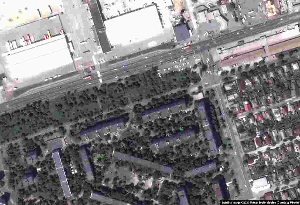 Before/after views of apartment buildings and damage in the Zhovteneyvi district of Mariupol.