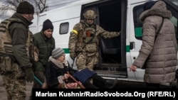 An elderly woman is evacuated from Irpin in the Kyiv region on March 9. 