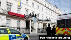 Squatters display banners and a Ukrainian flag as they occupy a building in London on March 14.