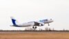 Armenia - A FlyOne Armenia plane takes off from Yerevan's Zvartnots airport, March 17, 2022.