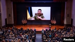Ukrainian President Volodymyr Zelenskiy delivers a video address to senators and members of the House of Representatives gathered at the U.S. Capitol in Washington in March 2022.