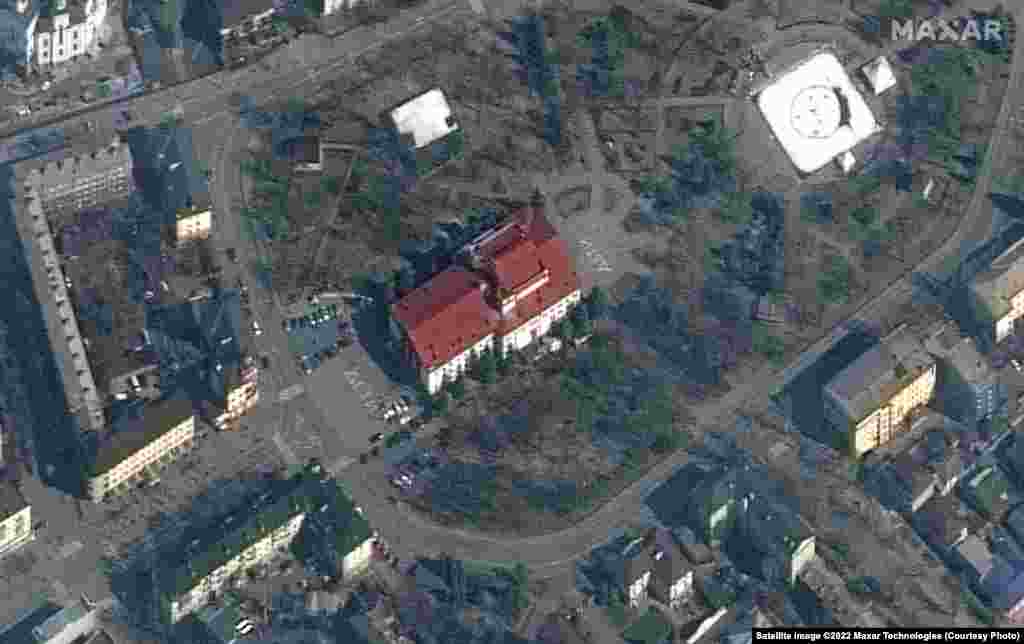 This satellite image taken of the theater on March 14 shows the word &ldquo;children&rdquo; written in Russian in large white letters in front of and behind the building.
