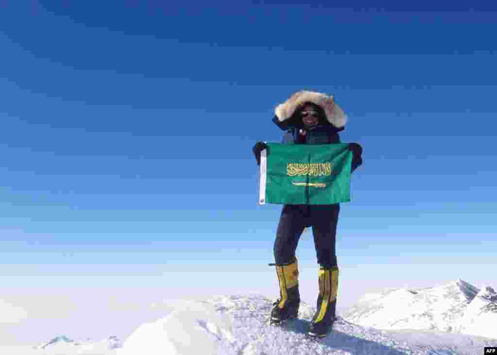 Saudi Arabian climber Raha Moharrak poses on Mount Everest on May 18, 2013. Moharrak is the first Saudi woman and the youngest Arab to climb the peak. 