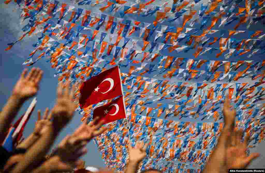 Supporters of Turkish President Tayyip Erdogan gesture as they attend an election rally in Istanbul on June 22. (Reuters/Alkis Konstantinidis)