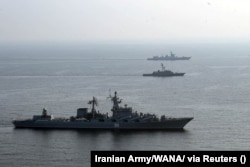 Warships attend a joint naval exercise of the Iranian, Chinese, and Russian navies in the northern Indian Ocean in January.