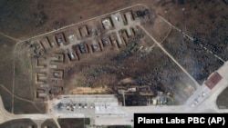 This satellite image provided by Planet Labs PBC shows destroyed Russian aircraft at the Saki Air Base after explosions on August 9.