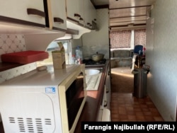 A typical shared kitchen inside a caravan for seasonal workers.