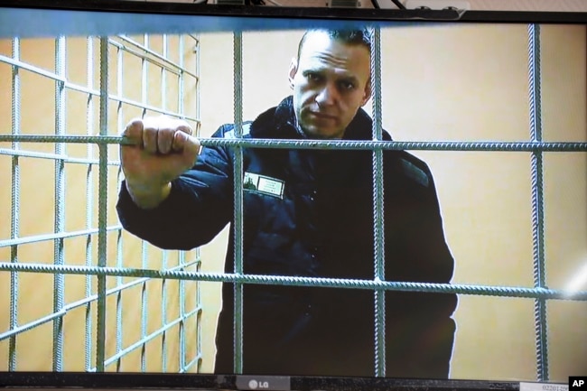 Aleksei Navalny looks at a camera while speaking from prison via video link during a court session in January.