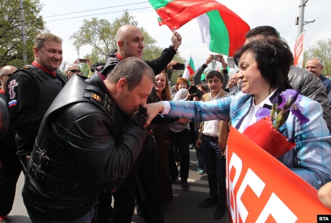 Members of the Bulgarian Night Wolves greet pro-Russia politician Kornelia Ninova in 2017.