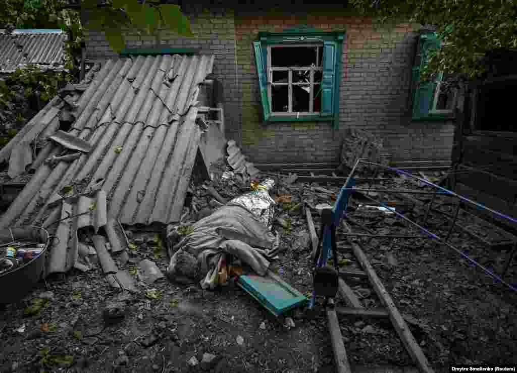 The body of an 11-year-old child who was killed in a Russian military strike lies on the ground in Chaplyne in Ukraine&#39;s Dnipropetrovsk region.