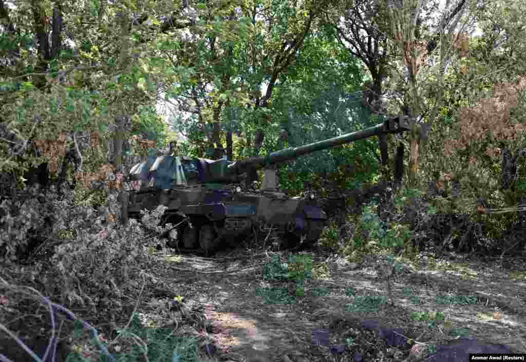 Ukrainian soldiers drive a self-propelled AHS Krab howitzer after engaging Russian forces in the Donetsk region on August 23. The Polish government donated 18 Krabs to assist the Ukrainian military in its defense against the Russian invasion.
