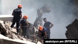 Armenia - Rescue workers continue to remove the rubble at the site of a major explosion and fire in the Surmalu shopping center in Yerevan. August 16, 2022.