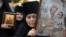 An Orthodox nun holds an icon during a protest against the international LGBT event EuroPride in Belgrade on August 28.