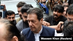 Former Pakistani Prime Minister Imran Khan, who is facing terrorism charges, appears in court to extend pre-arrest bail, in Islamabad on August 25.
