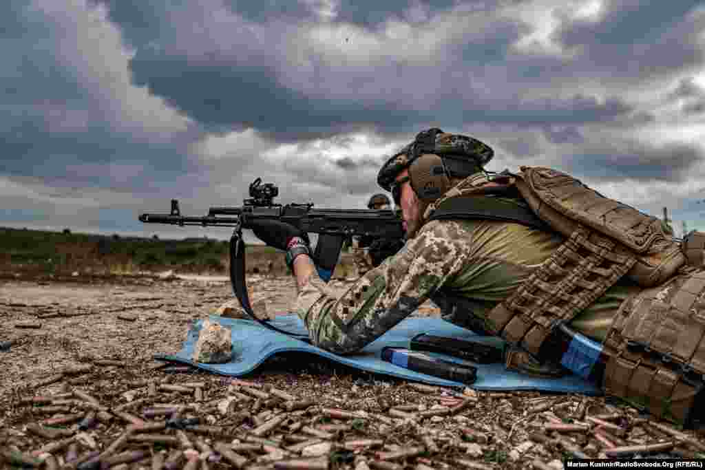 A Ukrainian soldier gets in some shooting practice at a training ground in an undisclosed location in the Donetsk region.