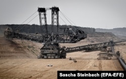 A brown coal excavator removes layers of soil in a mine operated by German energy supplier RWE near Juelich, Germany, in August.