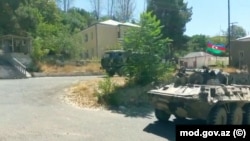 Azerbaijan Army units are seen entering Lachin on August 26.