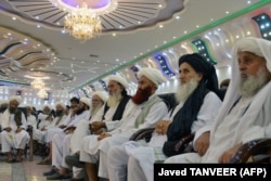 Taliban religious scholars attend a public meeting on economic welfare in Kandahar on August 18.