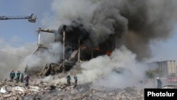 Armenia - Firefighters and rescue teams work at the Surmalu market in Yerevan rocked by a powerful explosion, August 14, 2022.