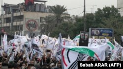 Bagdadyň köçelerinde eýran generaly Kasem Soleýmaniniň we yrakly leýtenant Abu Mahdi al-Muhandisiň ölüm ýyl dönümine bagyşlanan demonstrasiýalar. 1-nji ýanwar, 2022 ý. 
