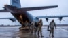 Airmen from the 4th Fighter Wing at Seymour Johnson Air Force Base, US, and the 48th Fighter Wing, Royal Air Force Lakenheath, England, arrive at Amari Air Base, Estonia, January 24, 2022. 