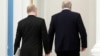 Russia's President Vladimir Putin (L) and Belarus' President Alexander Lukashenko leave after a joint press conference following their meeting at the Moscow Kremlin