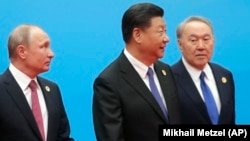 Oficialii chinezi au spus la început că protestele fără precedent din Kazahstan sunt o afacere internă.