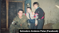 Spanish UN peacekeeper Salvadoro Andres Pelaez with 8-year-old Haris Behram and his cousin, 11-year-old Almir Behram, in a 1993 photo from Mostar, Bosnia-Herzegovina. 