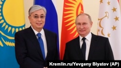 RUSSIA - Russian President Vladimir Putin, right, shakes hands with Kazakhstan President Kassym-Jomart Tokayev prior to meeting of leaders from the Commonwealth of Independent States (CIS) at Konstantin Palace in Strelna, outside St. Petersburg, Russia, T