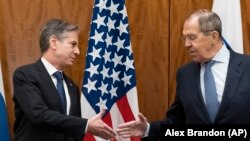 U.S. Secretary of State Antony Blinken (left) greets Russian Foreign Minister Sergei Lavrov before their meeting in Geneva on January 21. (file photo)