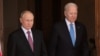 U.S. President Joe Biden (right) and Russian President Vladimir Putin arrive for a summit in Geneva on June 16, 2021.