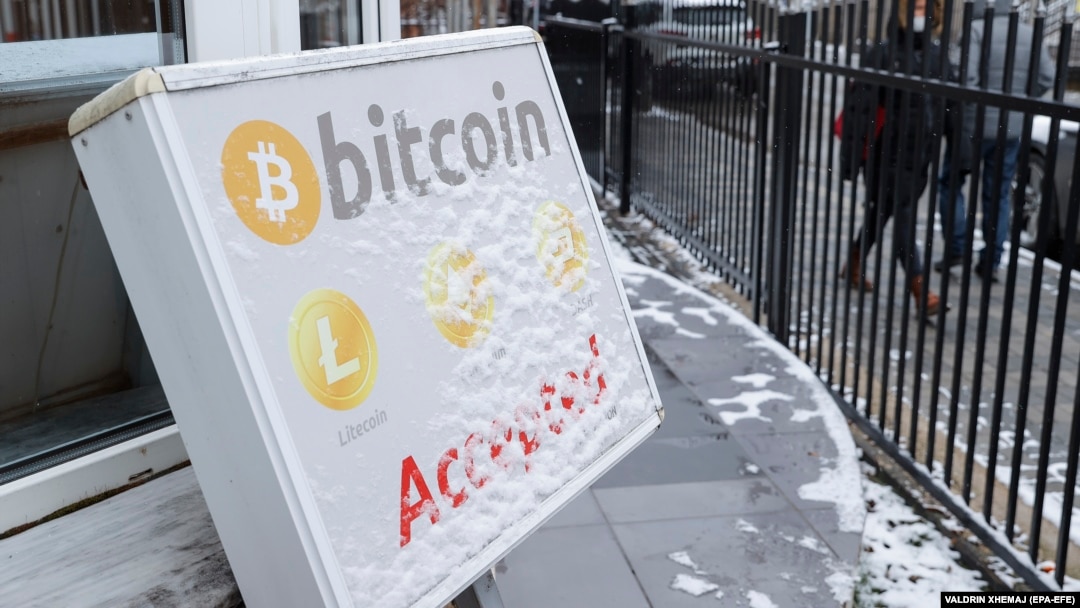 A bitcoin sign on display outside a crypto exchange office in the Kosovar capital, Pristina, on January 10. 