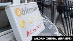 A bitcoin sign on display outside a crypto exchange office in the Kosovar capital, Pristina, on January 10. 