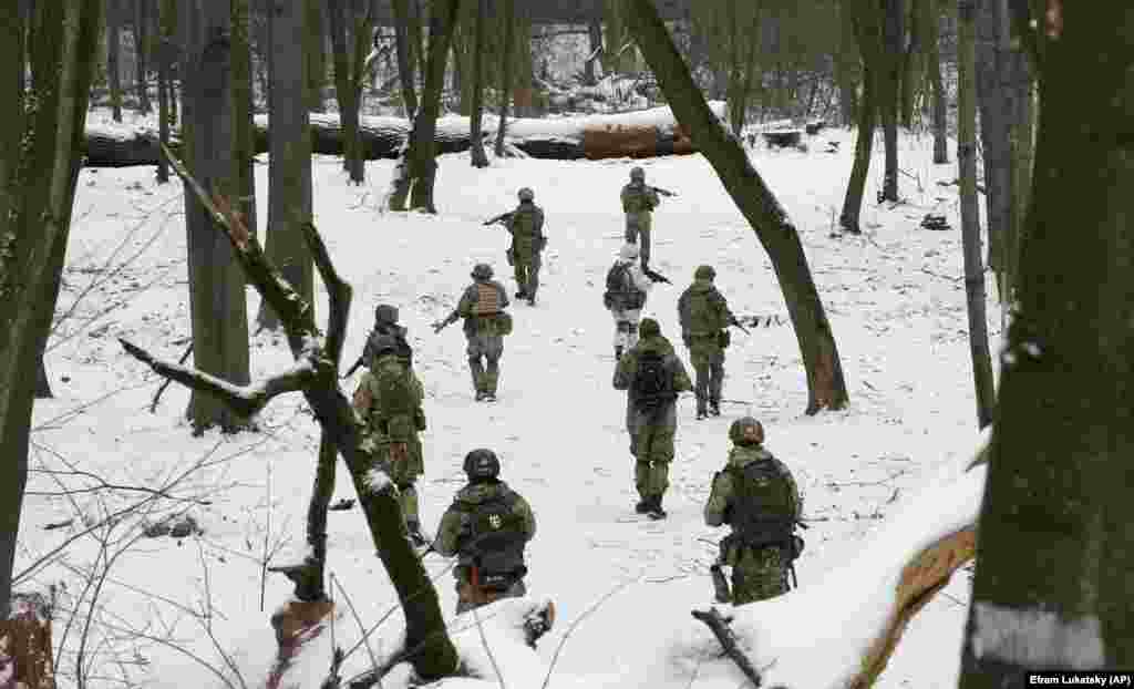 Members of volunteer military units train in a city park in Kyiv amid heightened tensions following a buildup of Russian forces near Ukraine&#39;s border.