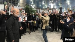 Families of the crash victims gather at Tehran's airport on the second anniversary of the disaster on January 8.