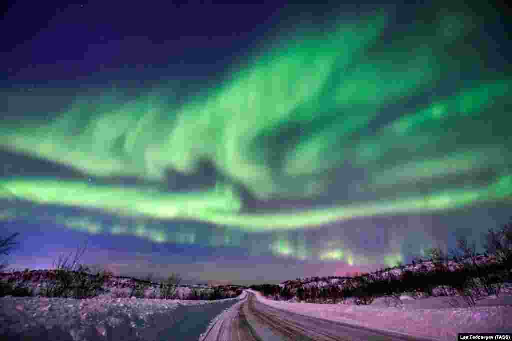 The Northern lights are seen over forest tundra in Russia&#39;s Murmansk region.