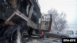 Сгоревший автомобиль в центре Алматы. 6 января 2022 года
